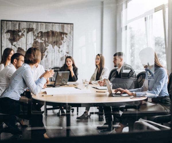 group-people-working-out-business-plan-office